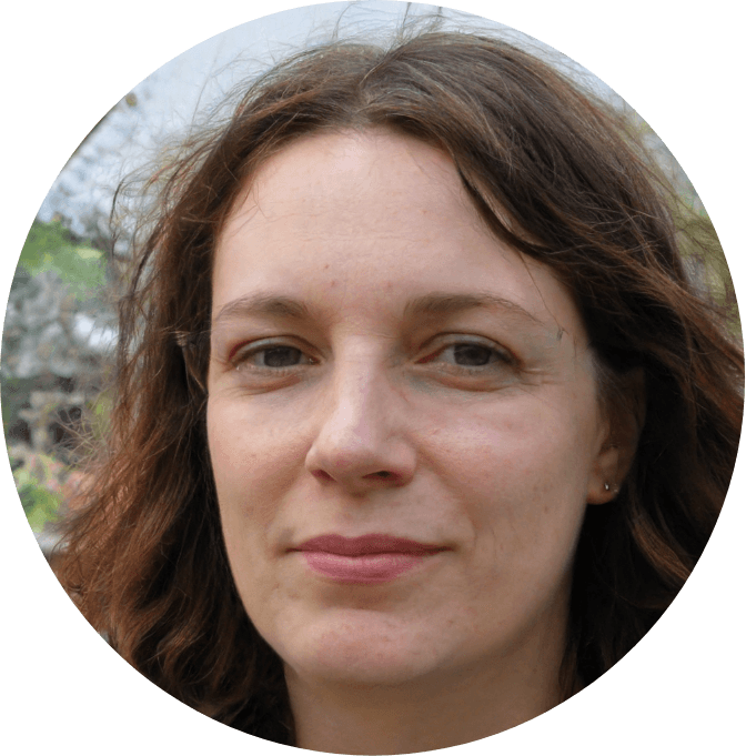 Image of a middle aged white woman with dark hair and gree eyes.